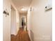 Hallway featuring wood flooring and white walls at 559 15Th Se Ave, Hickory, NC 28602