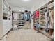 Large walk-in closet with custom shelving and ample storage space for shoes and clothing at 7009 Providence W Ln, Charlotte, NC 28226