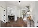 Elegant foyer features hardwood floors, white trim, and a view into the dining room and staircase at 7009 Providence W Ln, Charlotte, NC 28226