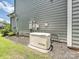 Rear exterior view of a home with a backup generator, ensuring reliable power during outages at 7009 Providence W Ln, Charlotte, NC 28226