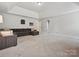 Spacious living room with neutral carpet, ample seating and natural light offering a welcoming space at 7009 Providence W Ln, Charlotte, NC 28226