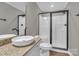 A modern bathroom with a white bowl sink, granite countertops, and a glass shower at 7032 Waxhaw Hwy, Lancaster, SC 29720