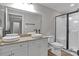 This bathroom features double sinks, a vanity with granite countertops, and a glass shower at 7032 Waxhaw Hwy, Lancaster, SC 29720