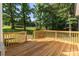 New wooden deck overlooks the backyard and features wooden railings and deck boards at 7032 Waxhaw Hwy, Lancaster, SC 29720