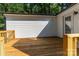 Exterior view of a new deck with wood railings, and a glimpse of the white siding of the home at 7032 Waxhaw Hwy, Lancaster, SC 29720