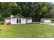 The exterior of this home features a gable roof and dormer, large front yard, deck, and a detached garage at 7032 Waxhaw Hwy, Lancaster, SC 29720