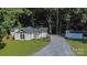 Charming single-Gathering home with a well-manicured lawn, detached garage and gravel driveway at 7032 Waxhaw Hwy, Lancaster, SC 29720