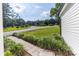 Stone walkway leads to the home from a gravel driveway and large, well-manicured front yard at 7032 Waxhaw Hwy, Lancaster, SC 29720