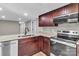 Close up of stainless steel appliances and granite countertops in modern kitchen at 7032 Waxhaw Hwy, Lancaster, SC 29720