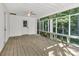 Light and bright screened porch with ceiling fan, built-in bench, and access to the backyard at 7032 Waxhaw Hwy, Lancaster, SC 29720