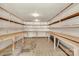 Spacious storage area with shelving, flooring supplies, and ample room for organization at 7032 Waxhaw Hwy, Lancaster, SC 29720