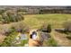 Wide aerial shot of the home's setting, surrounded by greenery and distant fields at 925 Marys Grove Rd, Cherryville, NC 28021