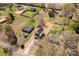 A neighborhood aerial view showcases a mix of homes surrounded by lush greenery at 925 Marys Grove Rd, Cherryville, NC 28021