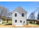 The backyard has a newly built house with white siding, complemented by a lush green lawn at 925 Marys Grove Rd, Cherryville, NC 28021