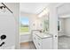 Modern bathroom featuring granite counters, dual sinks, and stylish fixtures with a view of the outdoors at 925 Marys Grove Rd, Cherryville, NC 28021