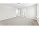 Bedroom featuring neutral carpet, base trim, and multiple doors at 925 Marys Grove Rd, Cherryville, NC 28021