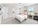 Sunlit bedroom with a serene view, featuring neutral colors and decor at 925 Marys Grove Rd, Cherryville, NC 28021