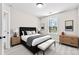 Bright bedroom with a cushioned bench, black headboard, and a picturesque window view at 925 Marys Grove Rd, Cherryville, NC 28021