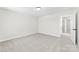 Bedroom featuring neutral carpet, base trim, and multiple doors at 925 Marys Grove Rd, Cherryville, NC 28021