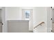 Bright hallway with window, neutral walls and natural wood handrail detail at 925 Marys Grove Rd, Cherryville, NC 28021