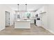 Well-lit kitchen with white cabinets, stainless steel appliances, and granite countertops at 925 Marys Grove Rd, Cherryville, NC 28021