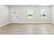 Bright living room featuring a decorative front door and two windows providing ample natural light at 925 Marys Grove Rd, Cherryville, NC 28021
