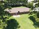 Aerial shot of a home featuring a backyard, lush green grass and mature trees at 938 Kannapolis Pkwy, Concord, NC 28027