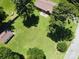 Home featuring a large backyard with green grass, tall mature trees, and detached garage at 938 Kannapolis Pkwy, Concord, NC 28027