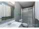 Bathroom with a vanity, toilet, and a glass-enclosed shower at 938 Kannapolis Pkwy, Concord, NC 28027