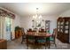 Traditional dining room with wood table, chairs, china cabinet, and chandelier at 938 Kannapolis Pkwy, Concord, NC 28027