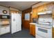 Practical kitchen layout with ample storage, a refrigerator, and essential cooking appliances at 938 Kannapolis Pkwy, Concord, NC 28027