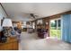 Bright and open living room with a fireplace, sliding glass doors, and comfortable seating at 938 Kannapolis Pkwy, Concord, NC 28027