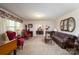 Inviting living room featuring plush seating, piano, and large windows with curtains at 938 Kannapolis Pkwy, Concord, NC 28027