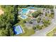 Aerial view of community amenities including swimming pools, tennis courts, and a basketball court at 9644 Marquette Nw St, Concord, NC 28027