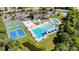 Aerial view of community amenities including swimming pools, tennis courts, playground and clubhouse at 9644 Marquette Nw St, Concord, NC 28027