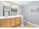 Bright bathroom featuring a double vanity and large mirror at 9644 Marquette Nw St, Concord, NC 28027