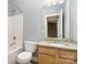 Bathroom featuring a bathtub, toilet, and vanity with granite countertop at 9644 Marquette Nw St, Concord, NC 28027