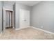 Bedroom with gray walls, neutral carpet, closet, and entrance into another room at 9644 Marquette Nw St, Concord, NC 28027