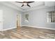 Bright bedroom showcasing two windows and tray ceilings at 9644 Marquette Nw St, Concord, NC 28027