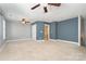 Expansive bedroom with modern touches, neutral carpet, and a fan at 9644 Marquette Nw St, Concord, NC 28027