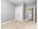 Bedroom with gray walls, large double door closet, and an entrance to another room at 9644 Marquette Nw St, Concord, NC 28027
