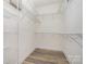 Walk-in closet featuring white wire shelving and wood-look floors at 9644 Marquette Nw St, Concord, NC 28027