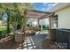 Landscaped backyard patio with pergola and built in fire pit at 9644 Marquette Nw St, Concord, NC 28027