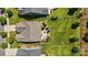 Aerial view showcases a roof, a patio with furniture, landscaping, and a vast green lawn in a neighborhood at 1108 Mayapple Way, Belmont, NC 28012