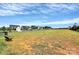 A well-maintained community space with a large lawn, walking path, and bench seating with houses in the distance at 1108 Mayapple Way, Belmont, NC 28012