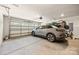 Spacious garage with an electric vehicle charger, ample storage, and a well-lit environment at 1108 Mayapple Way, Belmont, NC 28012