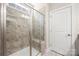 A glass enclosed shower with tiled walls and built in seating at 1108 Mayapple Way, Belmont, NC 28012