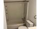 Cozy bathroom featuring a bathtub and shower combination, white toilet and vanity at 11123 Harrowfield Rd, Charlotte, NC 28226