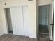 Bedroom featuring closet with sliding doors and a doorway leading to another room at 11123 Harrowfield Rd, Charlotte, NC 28226