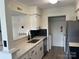 Well-lit kitchen featuring stainless steel appliances, stylish countertops, and a black backsplash at 11123 Harrowfield Rd, Charlotte, NC 28226